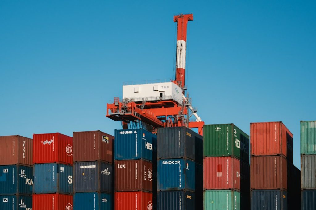 Illustrative image of shipping containers and cranes at a cargo port